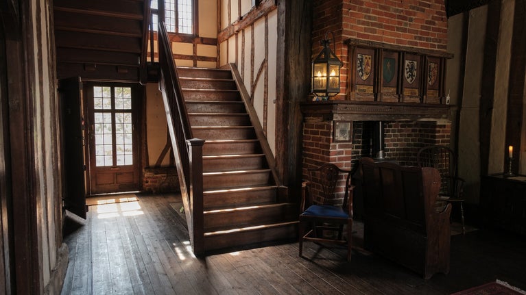 Sunlight bathes the great hall and main staircase of Paycocke's House, Essex